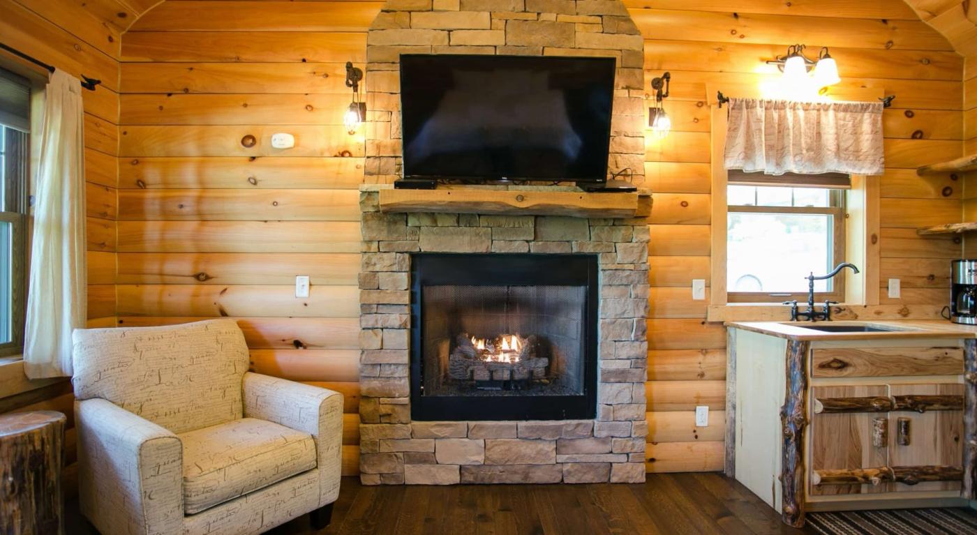 Amish Country Lodging cozy fireplace in log a cabin