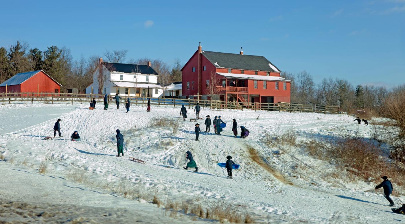 Amish families playing in the snow 