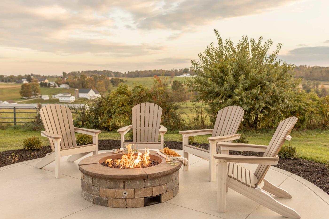 Poly outdoor Adirondack chairs around a fire pit