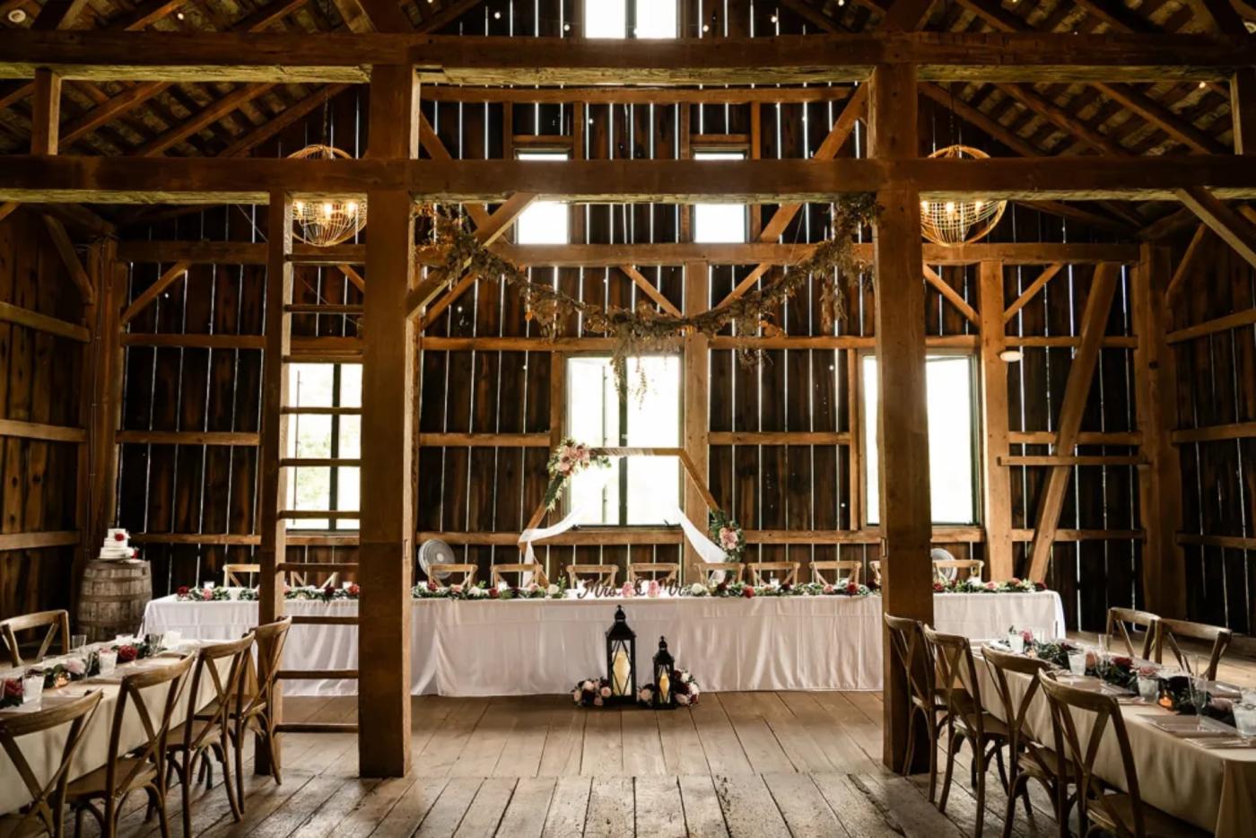 Interior of the barn with a wedding setup at Winesburg Farm